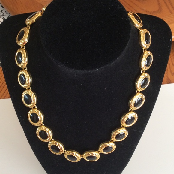 Jewelry - Gold tone and black necklace.